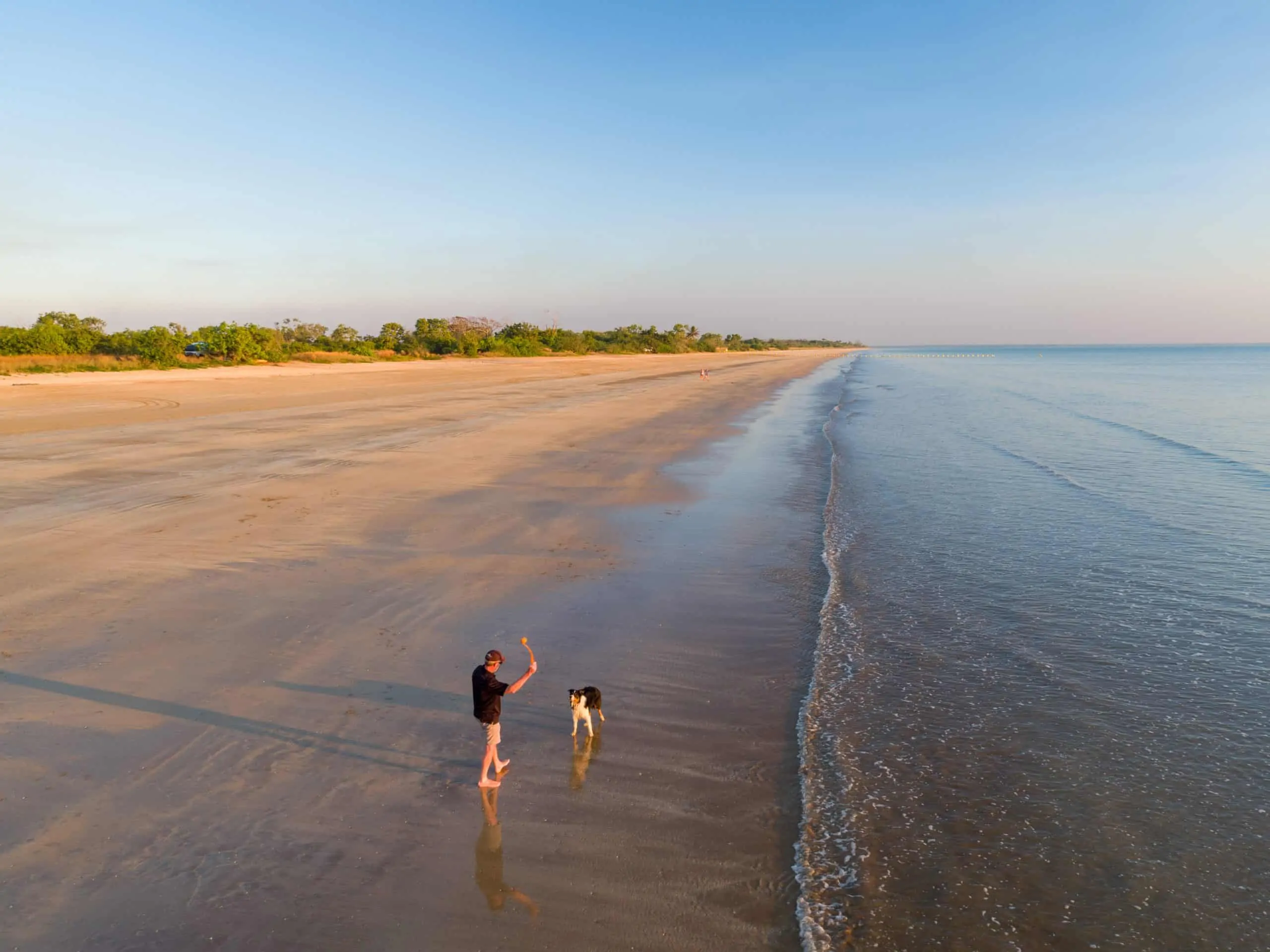 Gunn Point beach aerial hires-3 Aerial shot of a man and a dog at Gunn Point beach