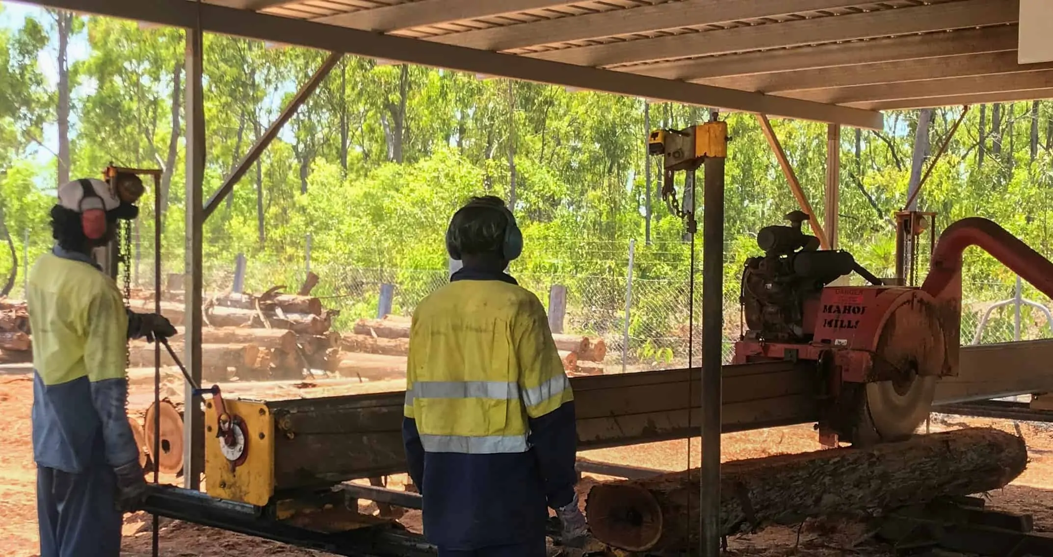 Workers at the Gumatj Aboriginal Corporation saw mill