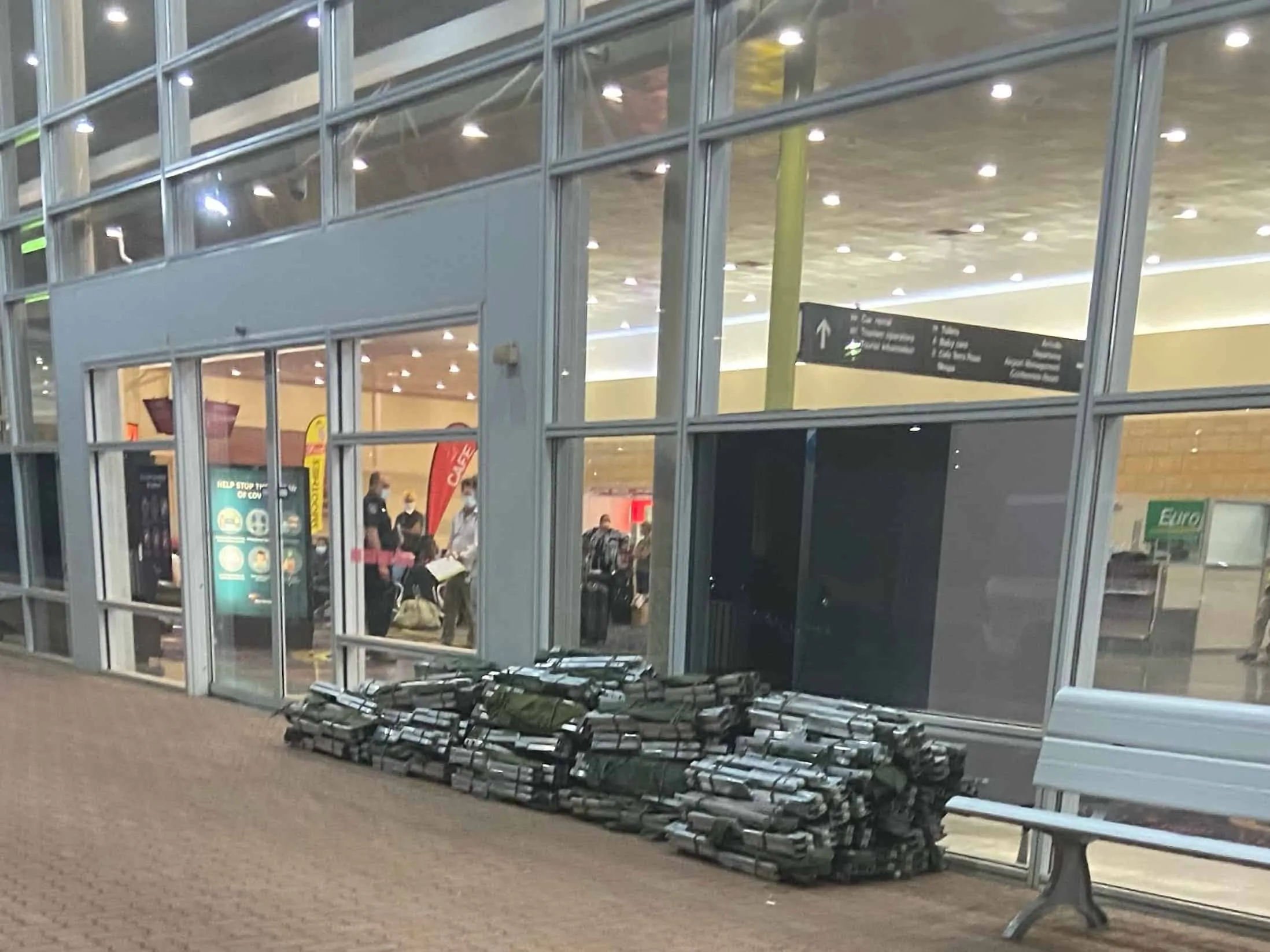 Foldable beds outside Alice Springs airport Cropped