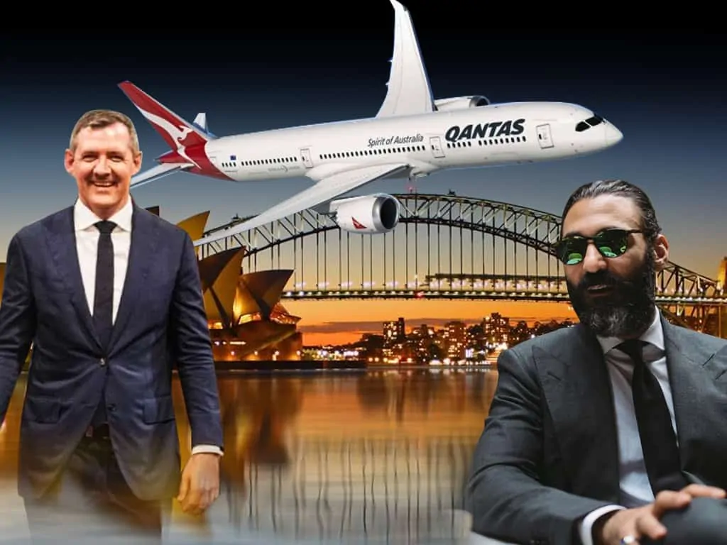 Gunner Sydney Trip Chief Minister Michael Gunner and tailor Roger Shamoun with a Qantas plane and Sydney as the backdrop