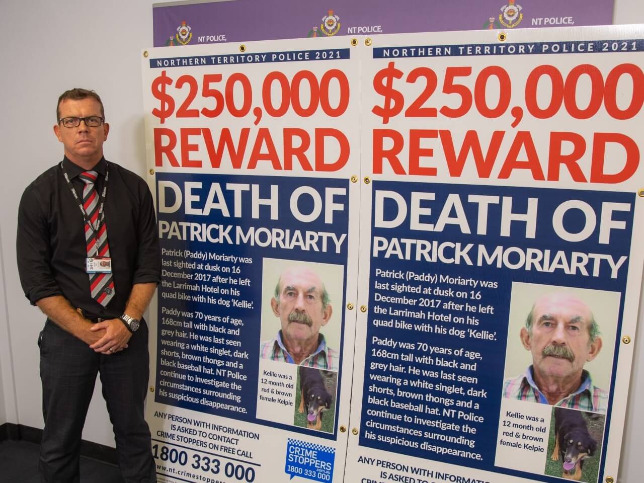 Mat Allen with reward signs 2 Cropped