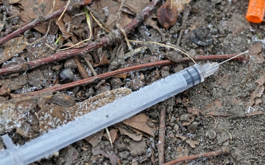 Syringe-wielding man arrested after robbing business on Sunday afternoon
